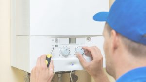 Water Heater Installation Technician Programming New Unit