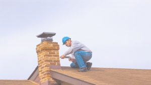 Technician Performing Chimney Repair